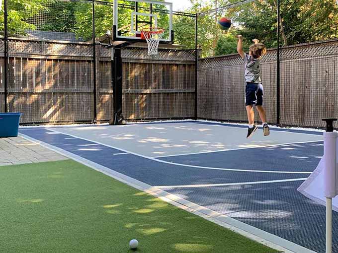 Outdoor basketball court with synthetic turf by Greenblock