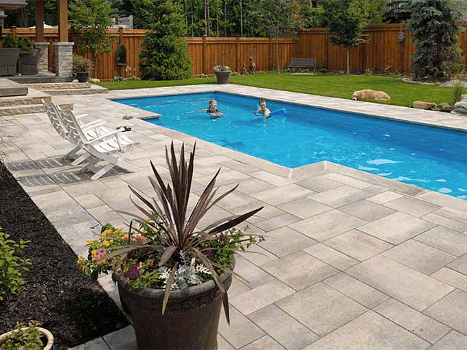 Luxury interlock patio with pool by Greenblock.
