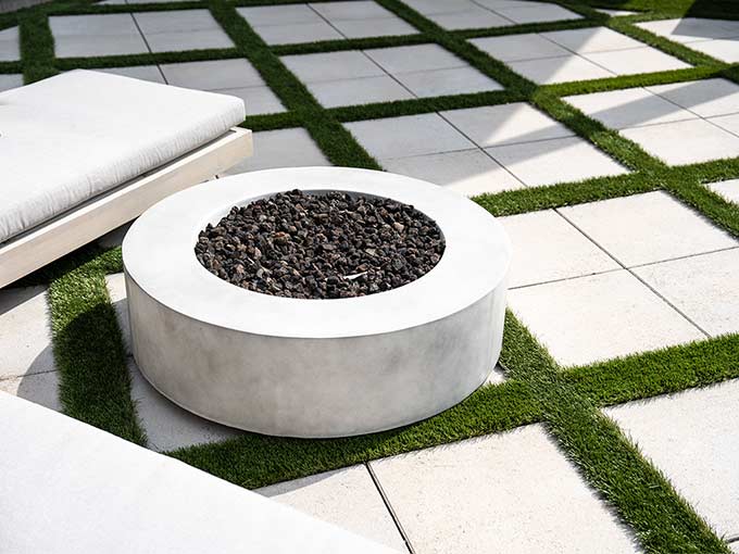 Interlock patio with synthetic grass and fire feature