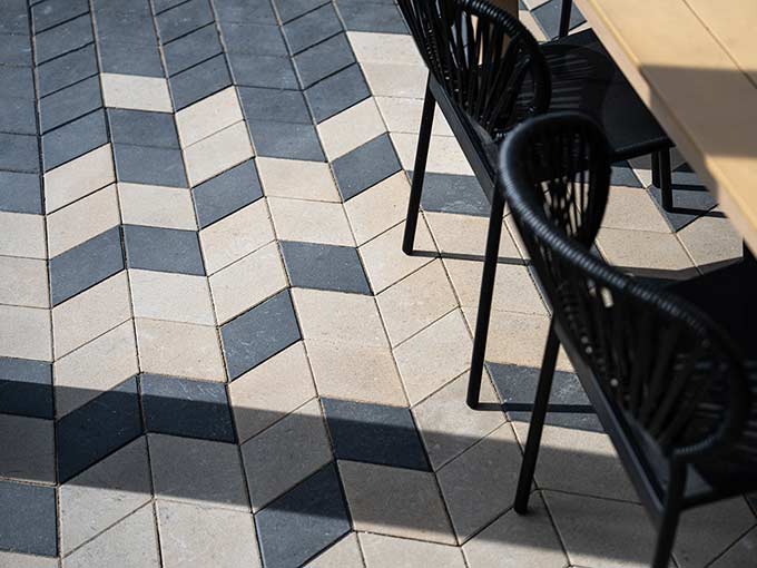 Modern interlock patio with geometric paver pattern and seating